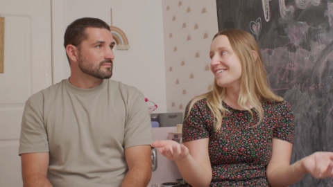 Mum shrugs having a conversation with Dad.