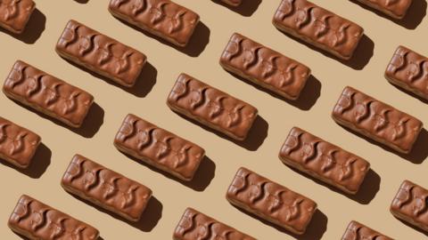 Lots of chocolate bars on a pale brown background