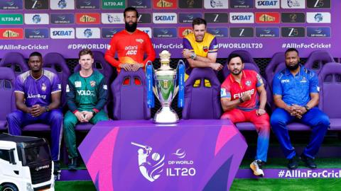 Jason Holder, Lockie Ferguson, Moeen Ali, Tim Southee, Gulbadin Naib and Kieron Pollard pose for a captains photo with the trophy before the fourth edition of the ILT20
