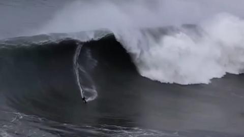 Surfers raced to California's famous Mavericks Beach surf spot to ride the huge waves