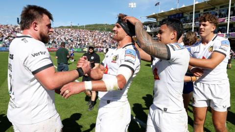 Exeter players celebrate winning at Bath