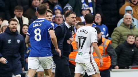 Cardiff City boss Omer Riza confronts Swansea City midfielder Goncalo Franco