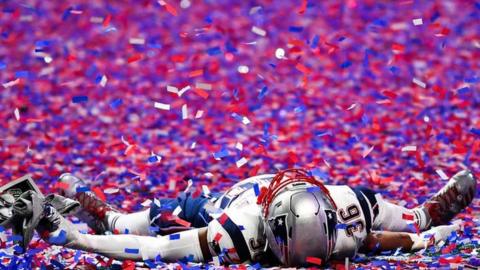 New England Patriots linebacker Brandon King (36) lays in the confetti after Super Bowl LIII