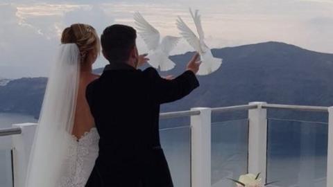 Sam and Laura release doves on their wedding day