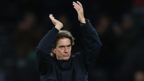 Spurs head coach Thomas Frank applauds fans after the home win against former club Brentford in the Premier League.