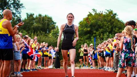 Phoebe Gill, 17, is clapped back into St Albans Athletic Club.