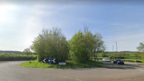 Google Maps image of the Chelwood roundabout with a couple of cars on it