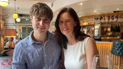 A mum and son in a restaurant