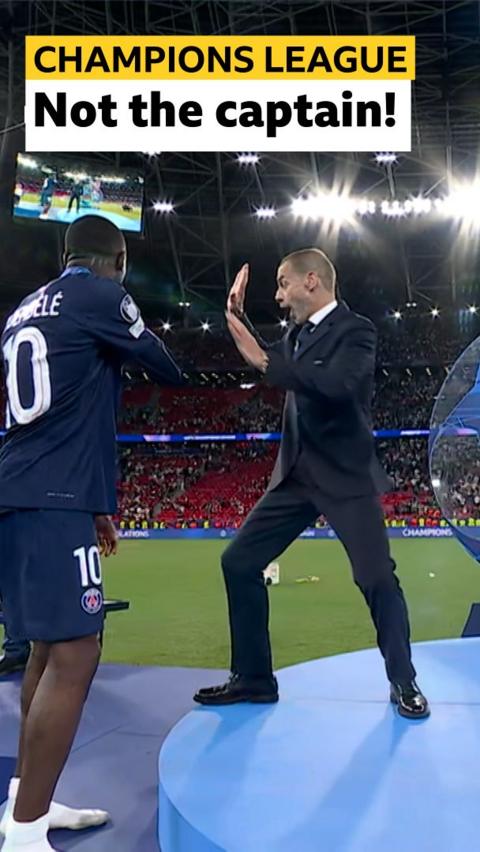 Dembele and Uefa official