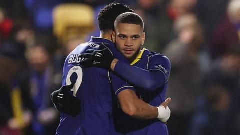Marcus Browne is congratulated by Omar Bugiel after scoring for AFC Wimbledon