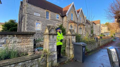 Police man outside the Weston-super-Mare property where a baby boy was found