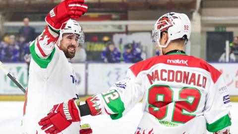 Josh MacDonald of Cardiff Devils celebrates a goal at Manchester Storm