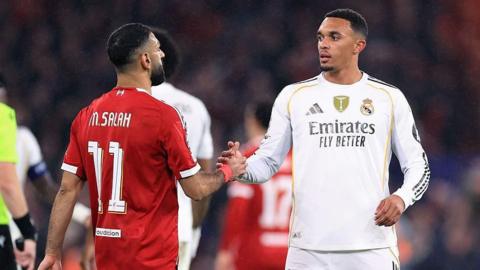 Mohamed Salah and Trent Alexander-Arnold shake hands after the game.