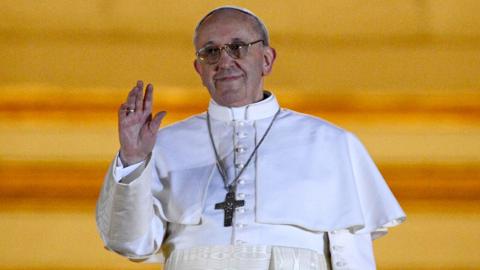 Pope Francis waves from the balcony of St. Peter's Basilica in 2013 after being elected as the new pope