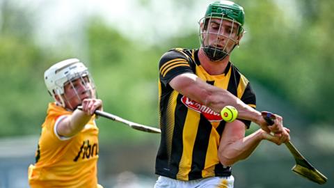 Kilkenny's Alan Murphy gets in a shot despite the efforts of Antrim's Rian McMullan