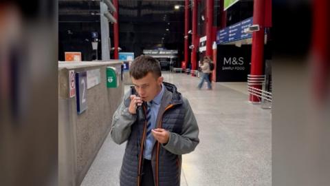 Joshua addressed passengers at Liverpool Lime Street when he visited with his school