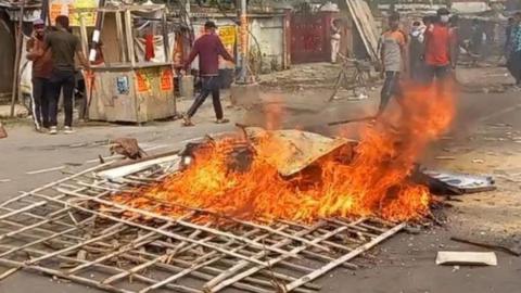 Youth set fire and protest at various places against 'Agneepath Scheme' implemented in armed forces on June 15, 2022 in Muzaffarpur, India.