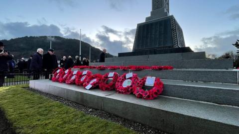 Poppy wreathes at memorial in St John's