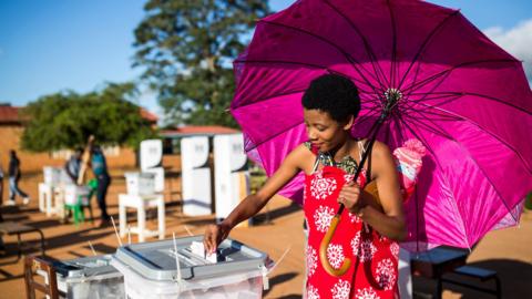 A woman casts her vote