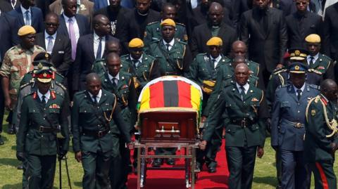 Mugabe coffin brought to the national sports stadium for a state funeral in Harare