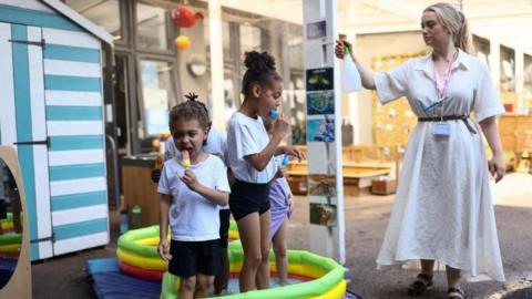 Pupils at the Harris Academy Primary Mayflower attend school during a heatwave
