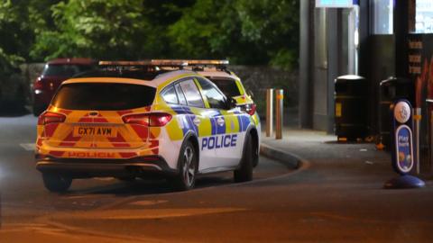 Police cars outside Southdowns pub in Bognor Regis at night time