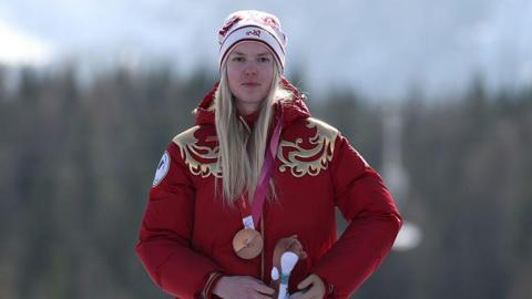 Varvara Voronchikhina on the Milan-Cortina Winter Paralympic podium