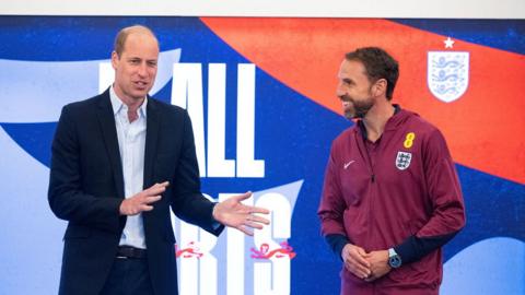 Prince William standing beside Gareth Southgate