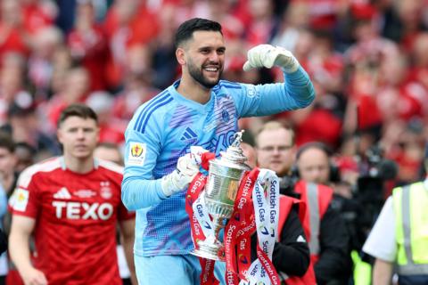 Dimitar Mitov of Aberdeen lifts the Scottish Gas Scottish Cup trophy after his team's victory in the Scottish Gas Scottish Cup Final match between Aberdeen and Celtic at Hampden Park