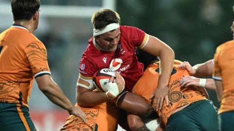 Wales Under-20s captain Deian Gwynne carries the ball into the Australia defence