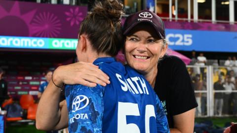 Linsey Smith is hugged by Charlotte Edwards