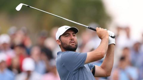 Scottie Scheffler takes a shot at a tournament