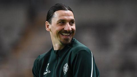 Zlatan Ibrahimovic laughs during a training session for Swedish club Hammarby