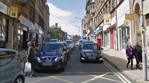 A street with shopfronts visible