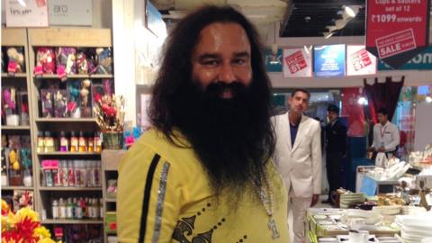 Indian spiritual guru Gurmeet Ram Rahim poses for a photograph after he was spotted at a shopping mall in New Delhi on January 5, 2015