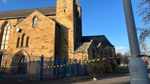 Sections of the former church have fallen onto the road