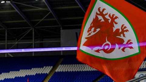 Wales football flag flies in the Cardiff City Stadium