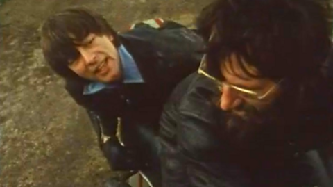 John Noakes in a motorcycle sidecar