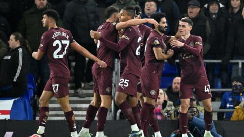 Manchester City's players celebrate a goal