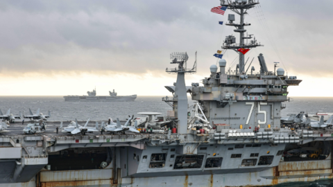 USS Harry S.Truman (foreground) with F/A-18E Super Hornet, Grumman E-2 Hawkeye and Sikorsky CH-53E Super Stallion on deck, HMS Prince of Wales (Background)