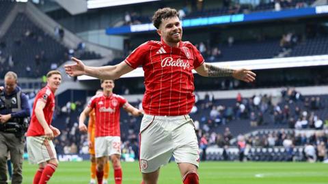 Neco Williams celebrates after scoring at Tottenham Hotspur Stadium