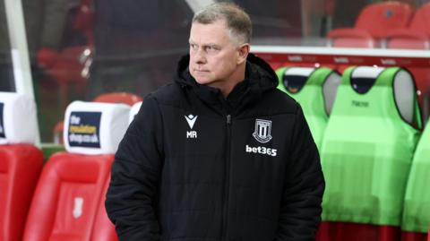 Stoke manager Mark Robins inside the technical area during their defeat to Middlesbrough