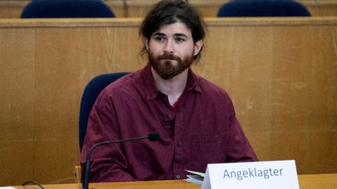 Franco A., a 32-year-old former soldier of Germany's army Bundeswehr, arrives for his verdict at a regional court in Frankfurt, Germany, July 15, 2022