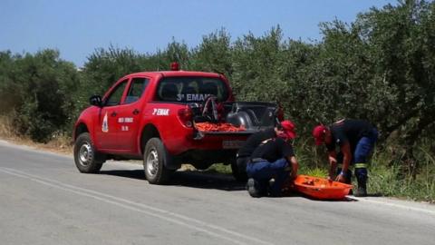 Emergency services prepare a stretcher