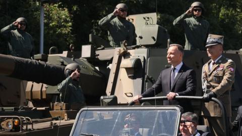 The Polish army Chief of General Staff, Gen Rajmund Andrzejczak (right) and Polish President Andrzej Duda (2nd right) during a military parade in Warsaw. Photo: 15 August 2023