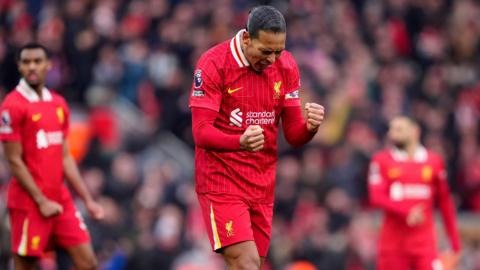 Liverpool captain Virgil van Dijk celebrates Liverpool's win against Wolves