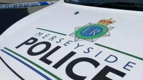 A close up photo of a Merseyside Police car bonnet
