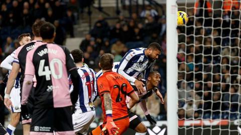 George Campbell heading in West Brom's goal