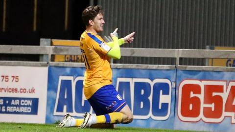 Andy Cook celebrates his late equaliser for Mansfield