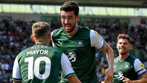 Finn Azaz celebrates with Danny Mayor